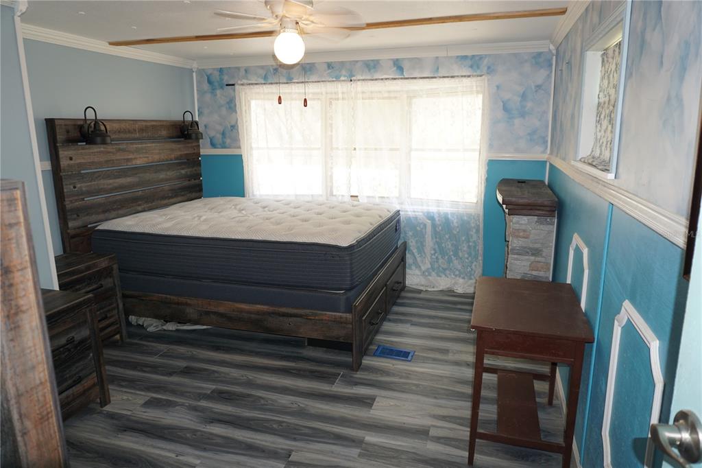 15371 Mango Drive Punta Gorda, FL 33955 - Photo 18 of 62 a room with wooden floor and windows