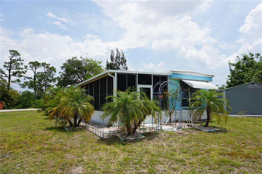 15371 Mango Drive Punta Gorda, FL 33955 - Photo 2 of 62 a view of a house with a yard and sitting area