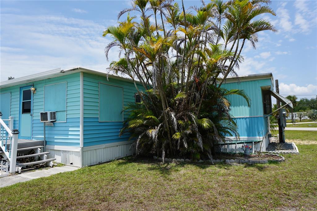 15371 Mango Drive Punta Gorda, FL 33955 - Photo 34 of 62 a backyard of a house with lots of green space