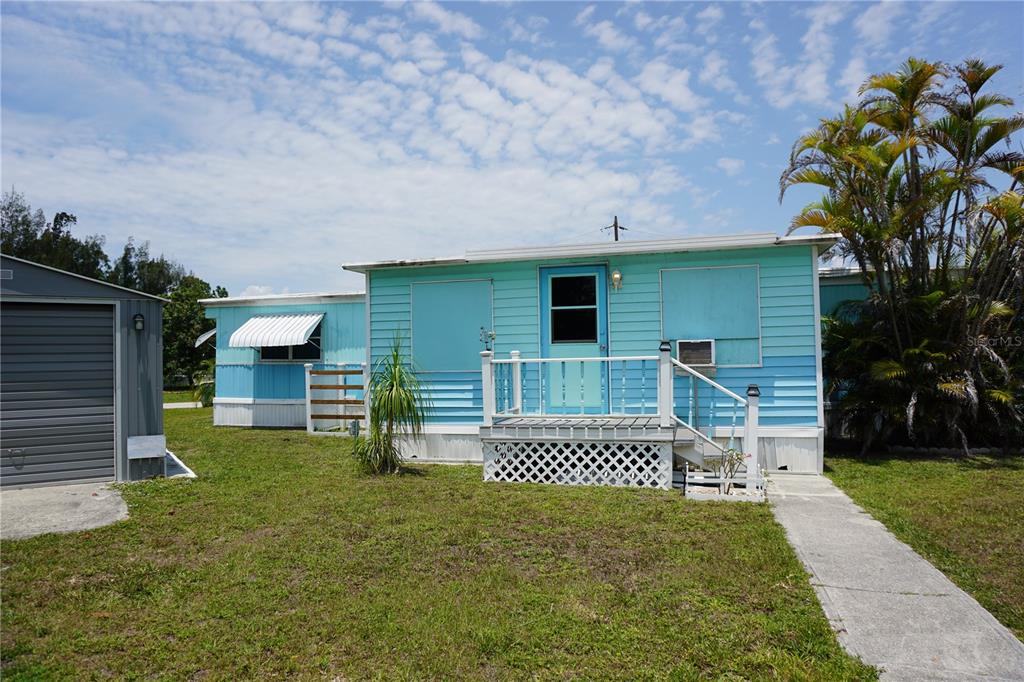15371 Mango Drive Punta Gorda, FL 33955 - Photo 35 of 62 front view of a house with a yard