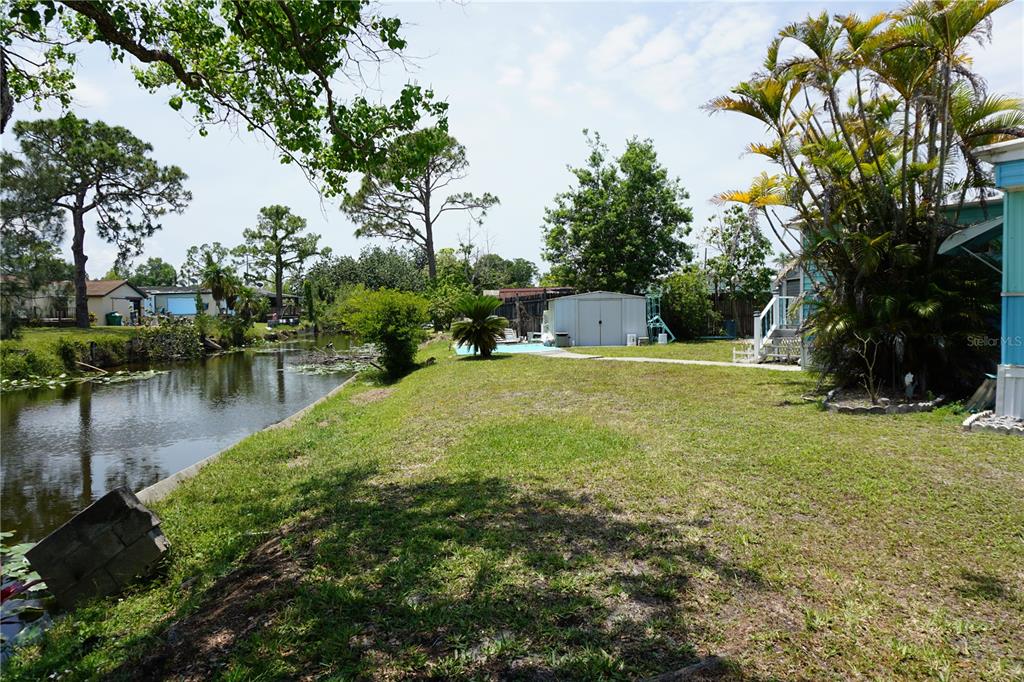 15371 Mango Drive Punta Gorda, FL 33955 - Photo 4 of 62 a view of a lake with a house in the background