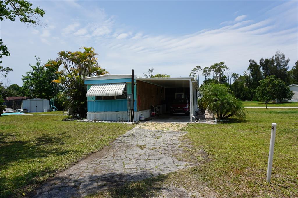 15371 Mango Drive Punta Gorda, FL 33955 - Photo 53 of 62 a front view of a house with garden