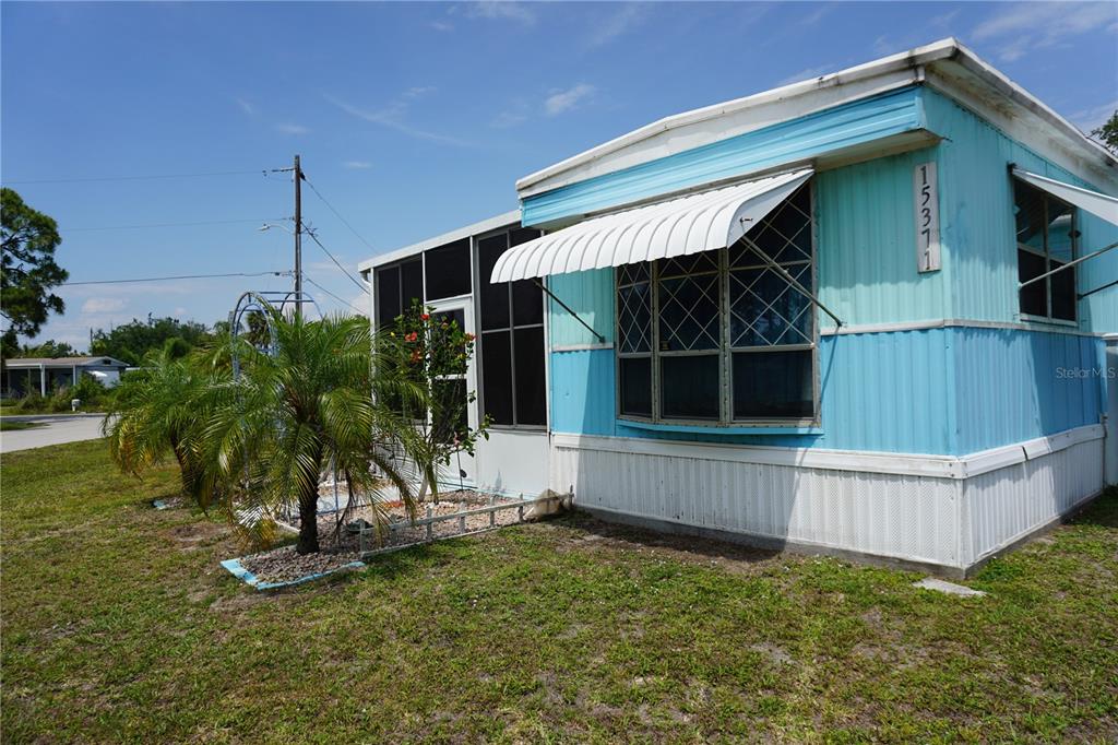 15371 Mango Drive Punta Gorda, FL 33955 - Photo 62 of 62 a view of a house with a yard