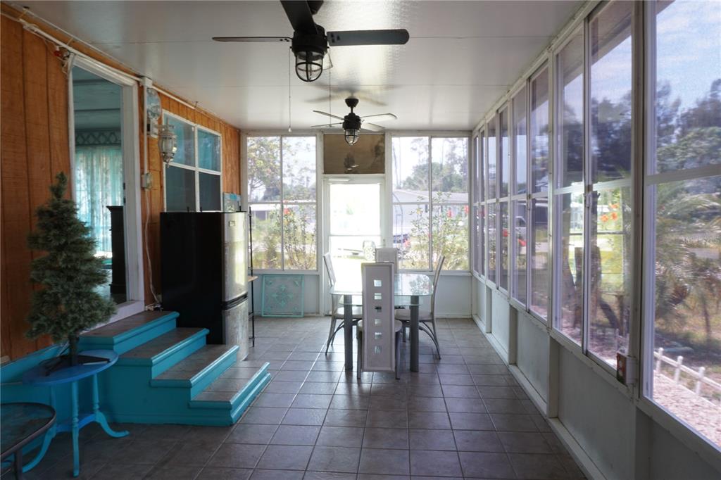 15371 Mango Drive Punta Gorda, FL 33955 - Photo 10 of 62 a dining room with furniture and large windows