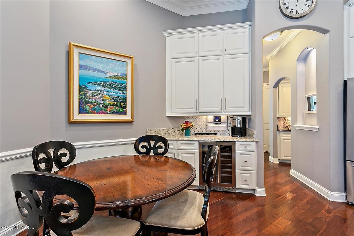504 Saddlestone Drive St. Johns, FL 32259 - Photo 12 of 42 a view of a dining room with furniture and wooden floor
