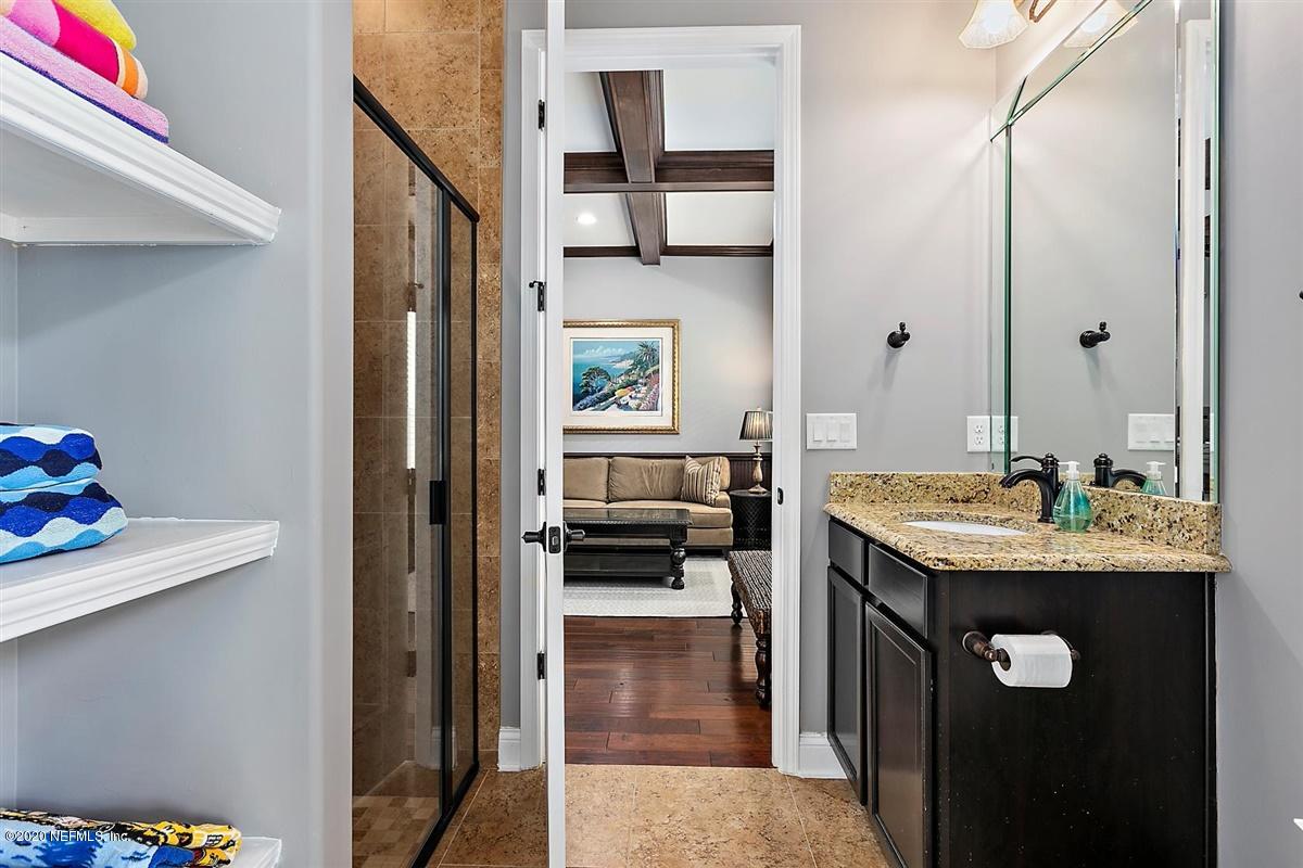 504 Saddlestone Drive St. Johns, FL 32259 - Photo 16 of 42 a en suite bathroom with a granite countertop sink and a mirror