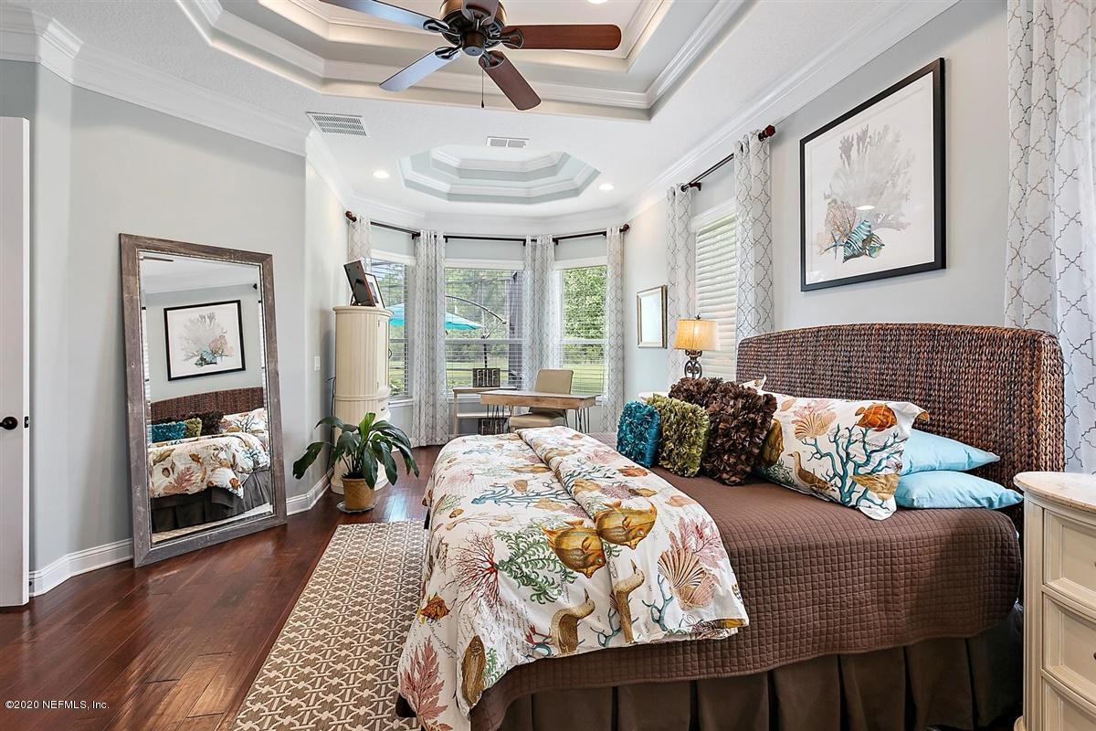 504 Saddlestone Drive St. Johns, FL 32259 - Photo 17 of 42 a bedroom with furniture and a large window
