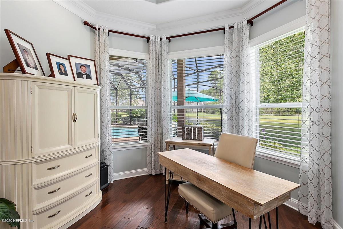 504 Saddlestone Drive St. Johns, FL 32259 - Photo 18 of 42 a view of a dining room with furniture window and wooden floor