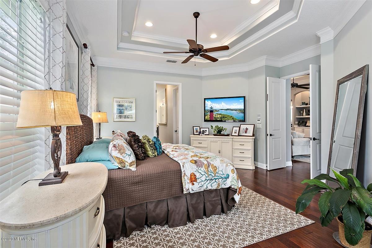 504 Saddlestone Drive St. Johns, FL 32259 - Photo 19 of 42 a living room with furniture and a chandelier