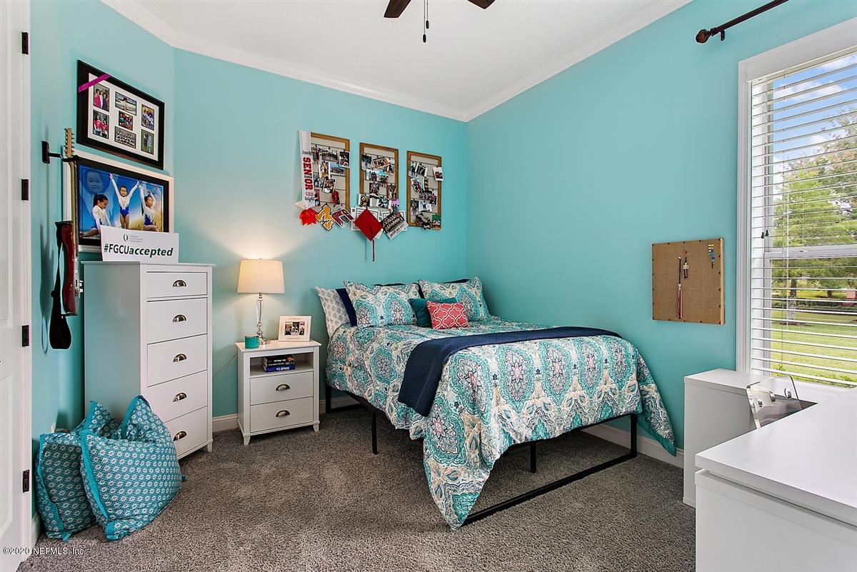 504 Saddlestone Drive St. Johns, FL 32259 - Photo 23 of 42 a bedroom with bed and a window