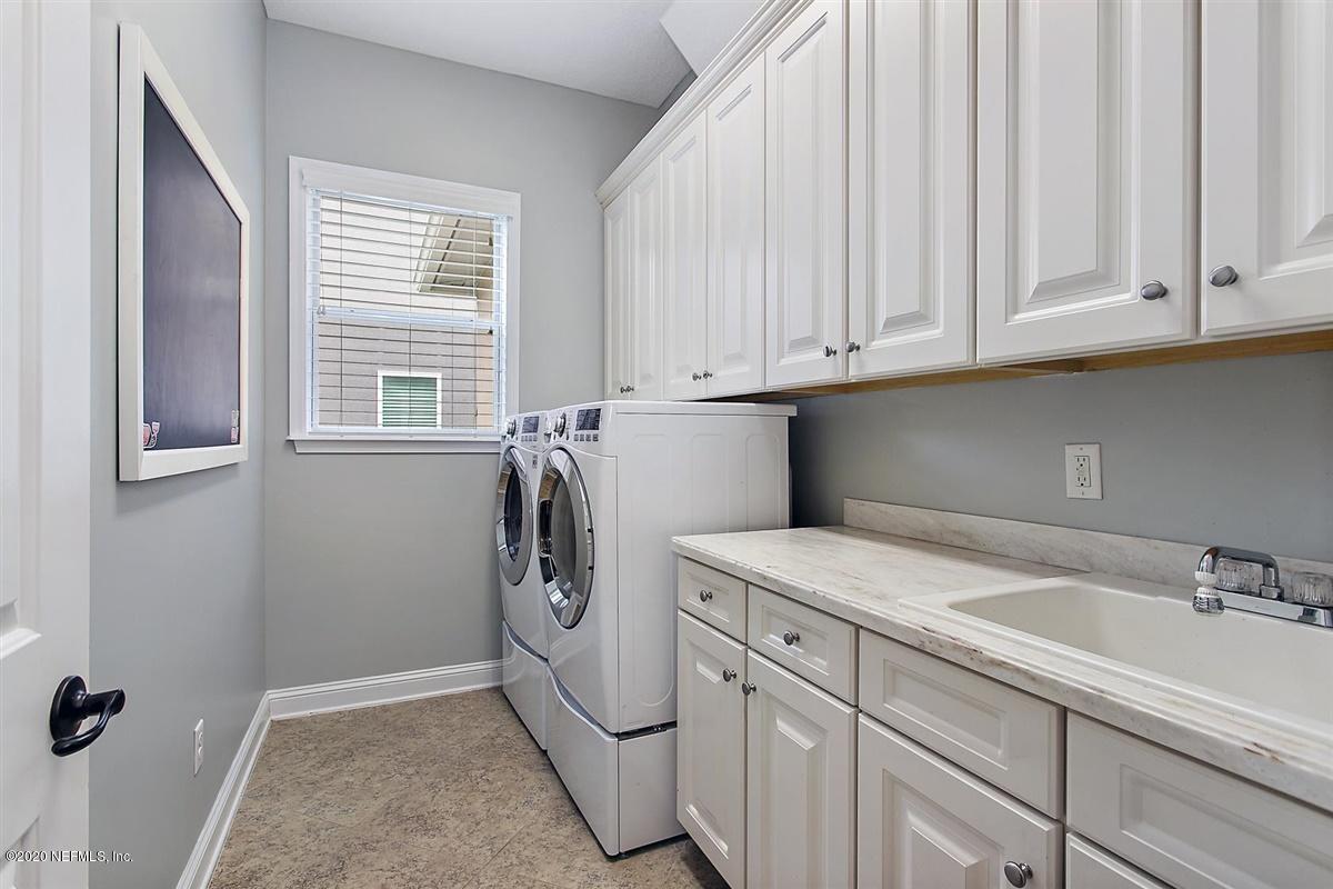 504 Saddlestone Drive St. Johns, FL 32259 - Photo 28 of 42 a utility room with dryer and washer