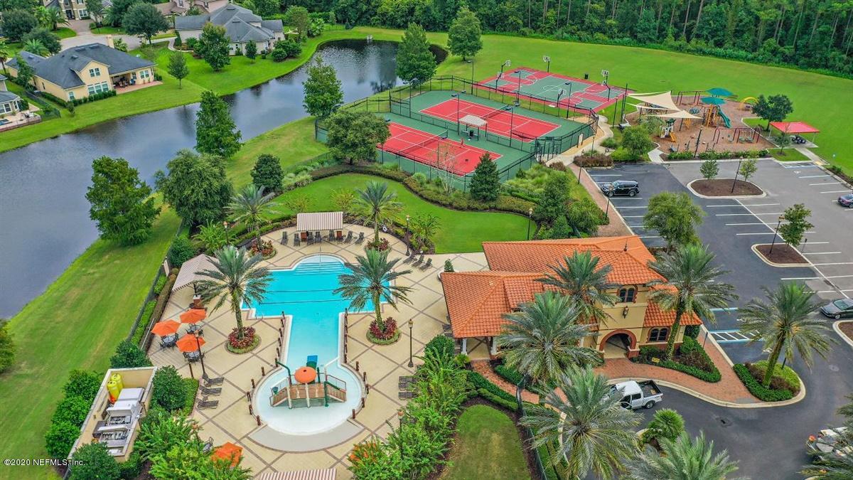504 Saddlestone Drive St. Johns, FL 32259 - Photo 39 of 42 an aerial view of a house swimming pool a yard and a fountain