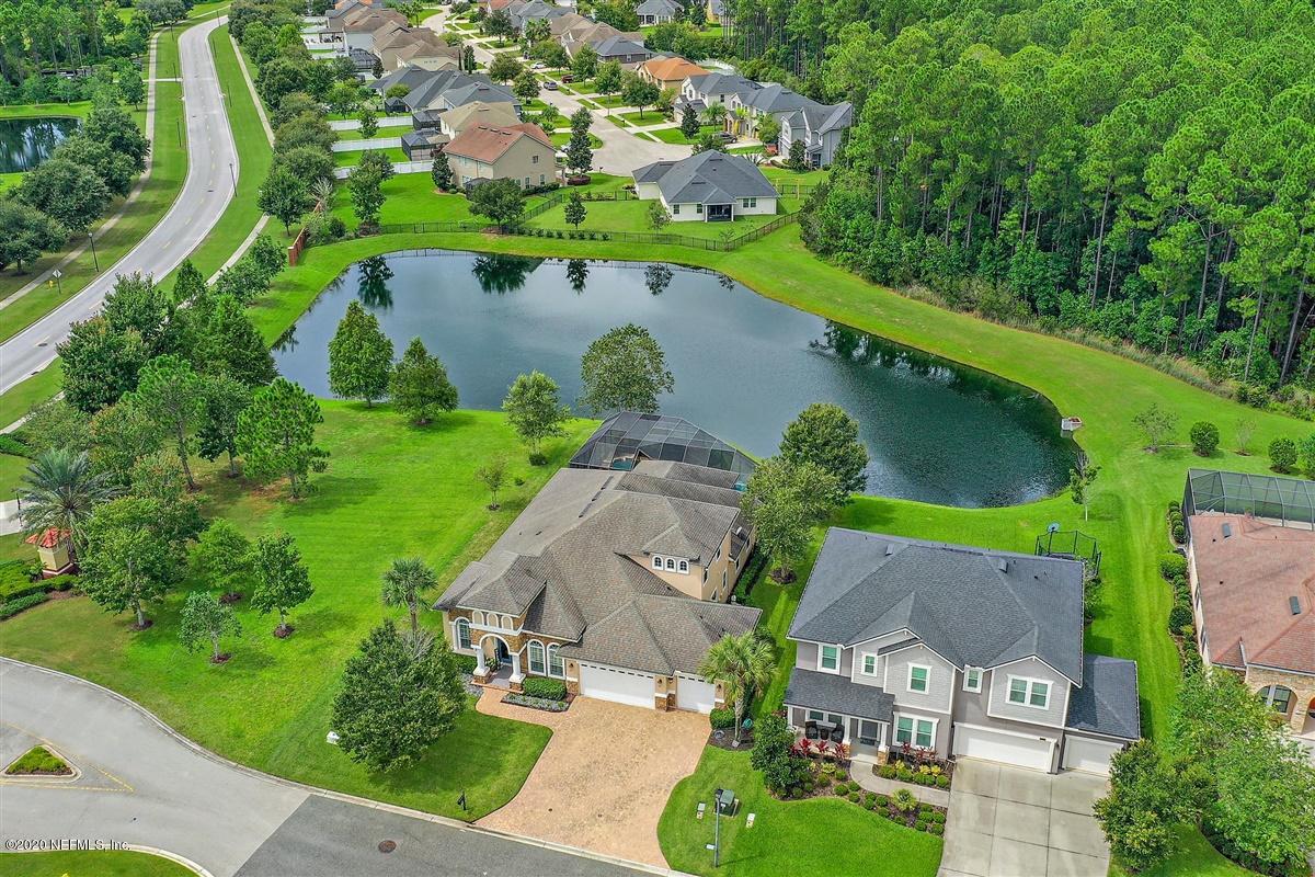 504 Saddlestone Drive St. Johns, FL 32259 - Photo 40 of 42 an aerial view of a house with outdoor space and a lake view