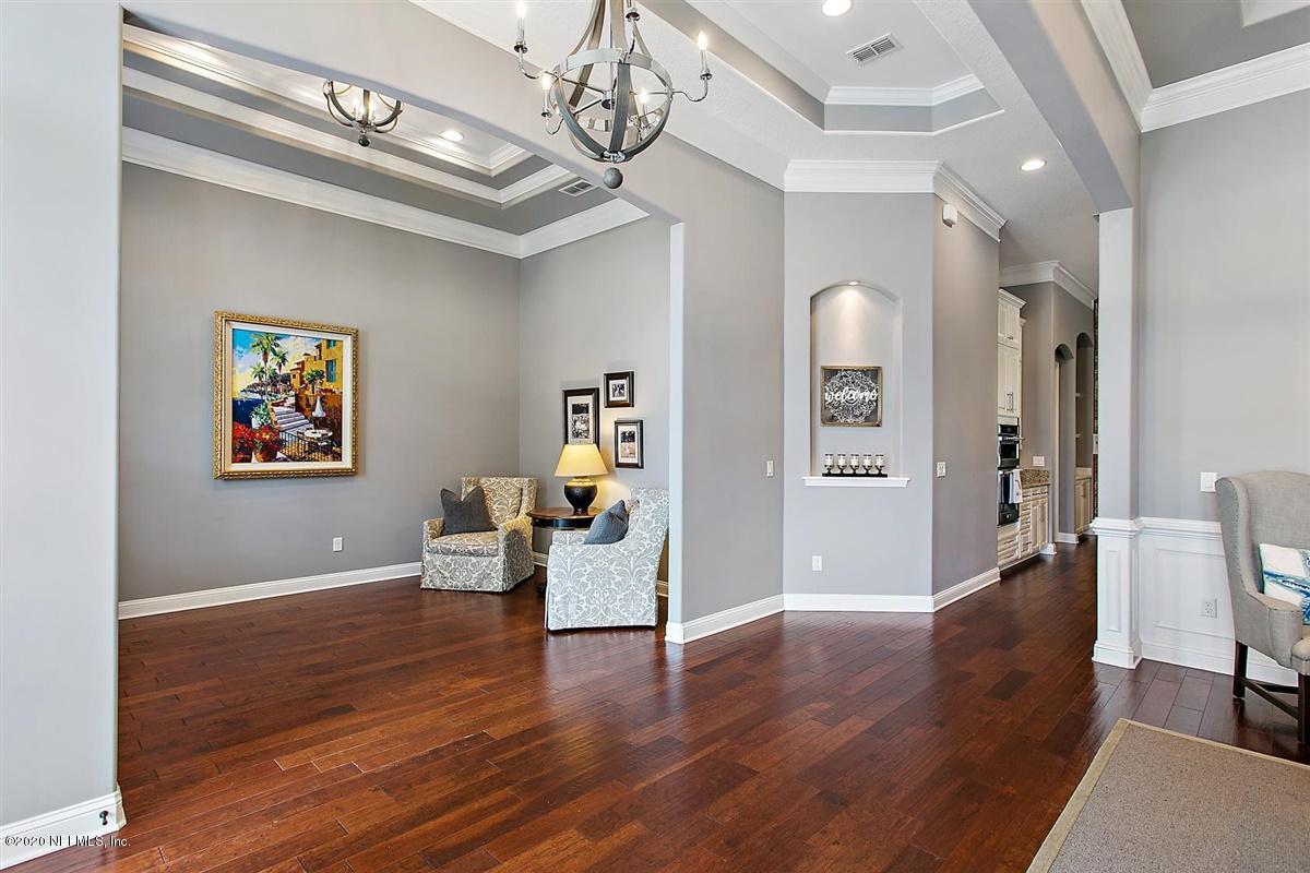 504 Saddlestone Drive St. Johns, FL 32259 - Photo 4 of 42 a view of a livingroom with furniture wooden floor and a chandelier