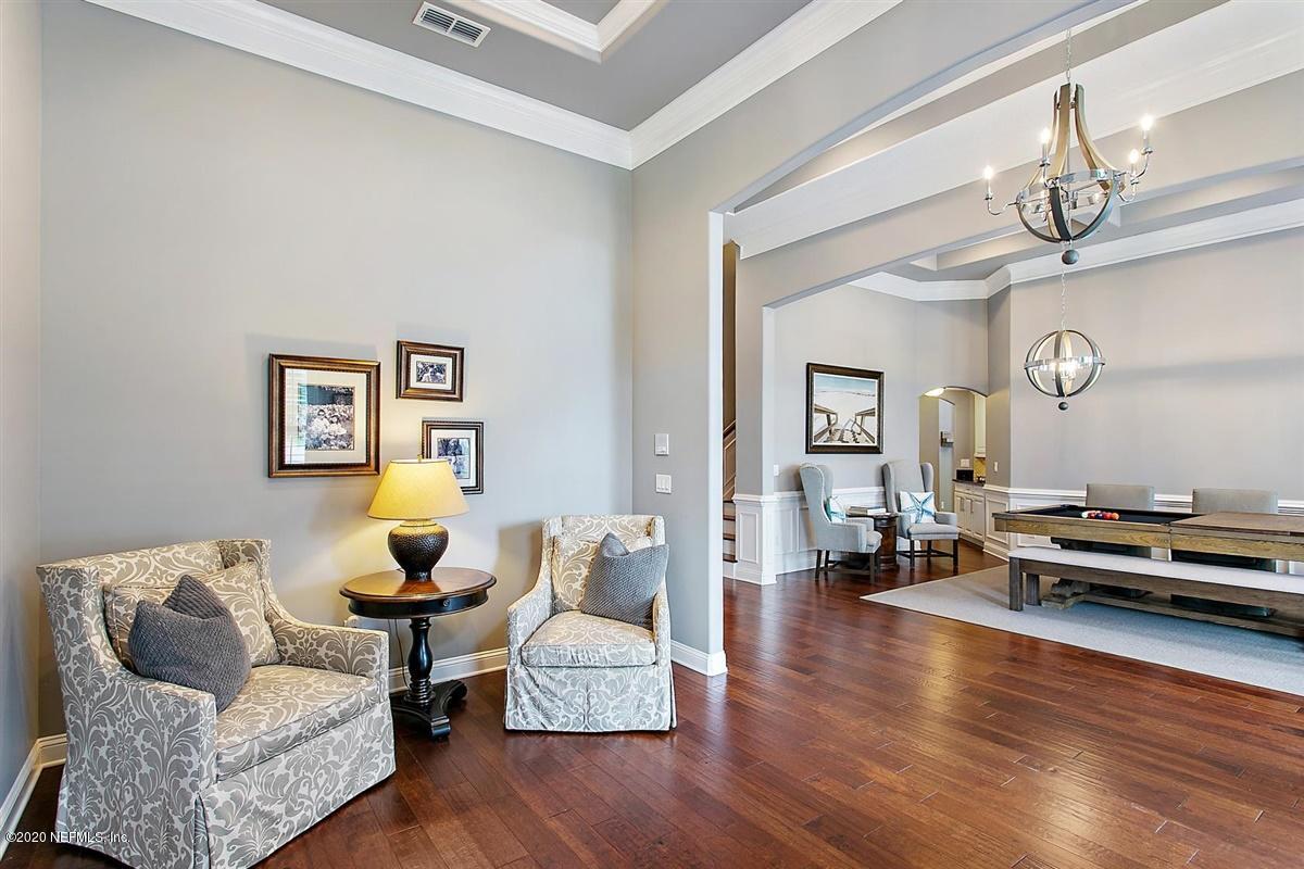 504 Saddlestone Drive St. Johns, FL 32259 - Photo 5 of 42 a living room with furniture and wooden floor