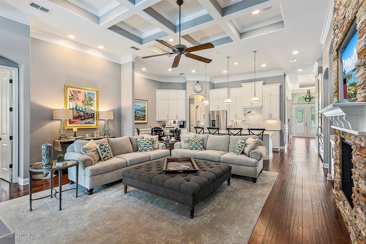 504 Saddlestone Drive St. Johns, FL 32259 - Photo 9 of 42 a living room with furniture and a fireplace