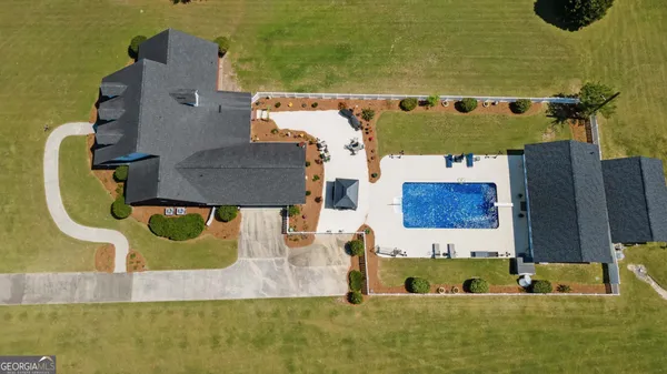 an aerial view of a house with a lake view
