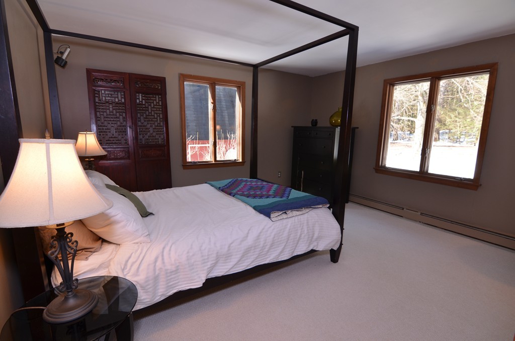 13 Whitman Road Harvard, MA 01451 - Photo 22 of 30 a bedroom with a bed next to a window