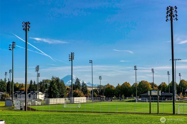 a front view of a building with parking space