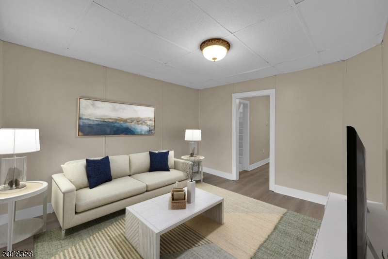 a living room with furniture and a rug