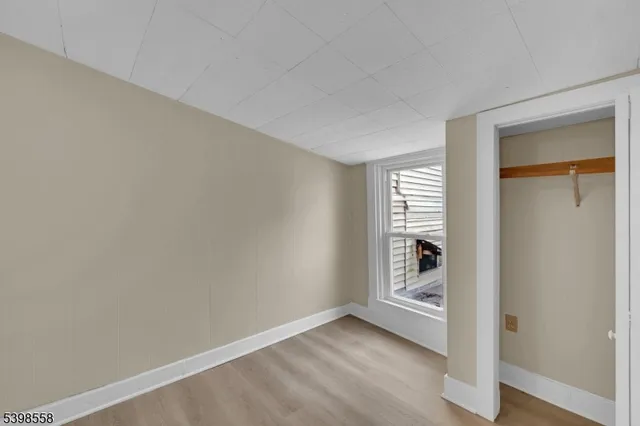 a view of an empty room and a window