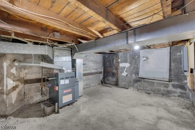 a view of empty room with wooden ceiling