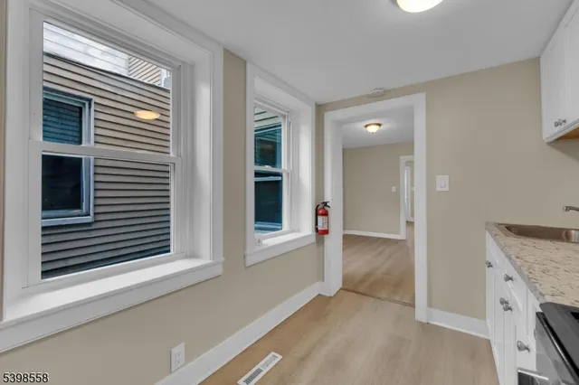 a view of a kitchen cabinets and a kitchen counter