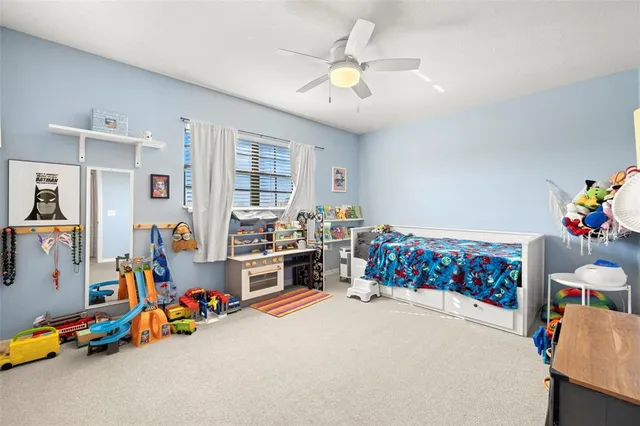 a bed room with a bed and a chandelier