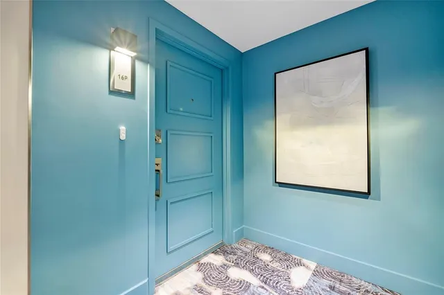 a view of an empty room with glass door