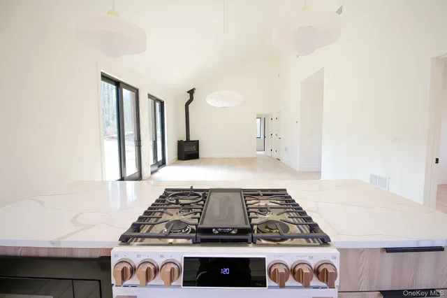 a kitchen with a stove and cabinets