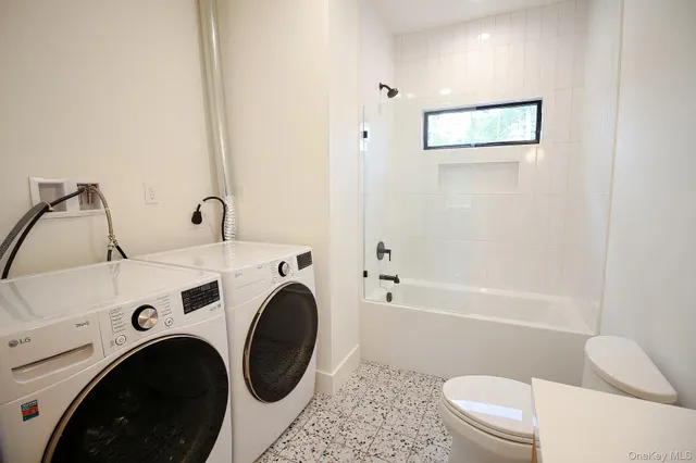 a bathroom with a sink a toilet and bathtub