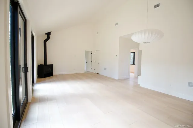 a view of a room with a furniture and a ceiling fan