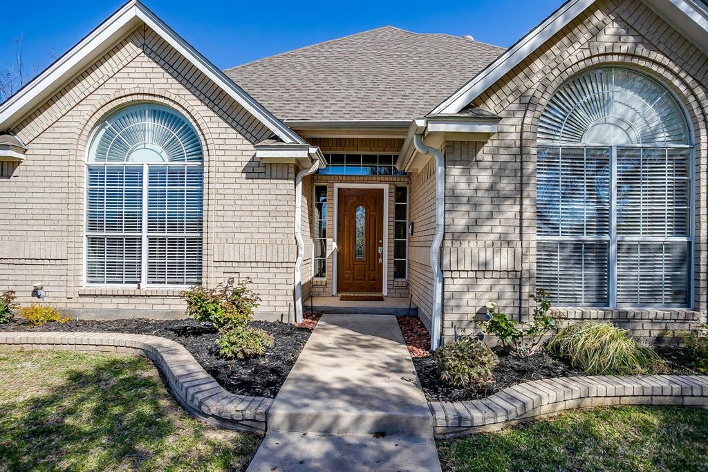 2300 Walter Smith Road Azle, TX 76020 - Photo 2 of 40 a front view of a house with garden