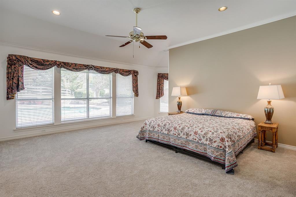 2300 Walter Smith Road Azle, TX 76020 - Photo 24 of 40 a bedroom with a large bed and a large window