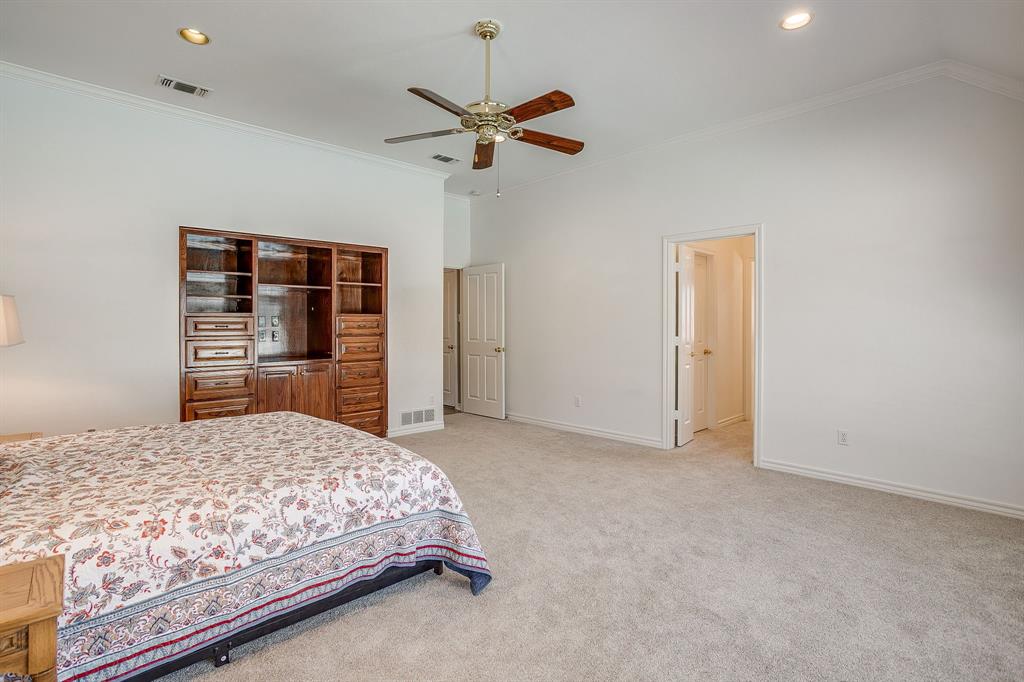 2300 Walter Smith Road Azle, TX 76020 - Photo 25 of 40 a bedroom with a bed and a dresser