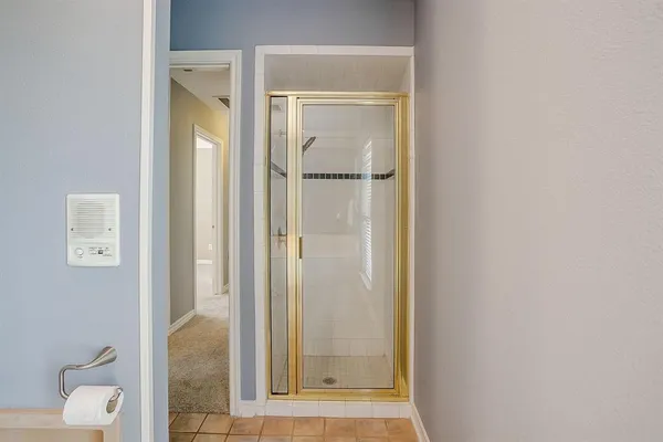 a bathroom with a sink mirror and toilet