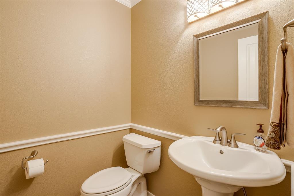 2300 Walter Smith Road Azle, TX 76020 - Photo 30 of 40 a bathroom with a sink mirror and toilet