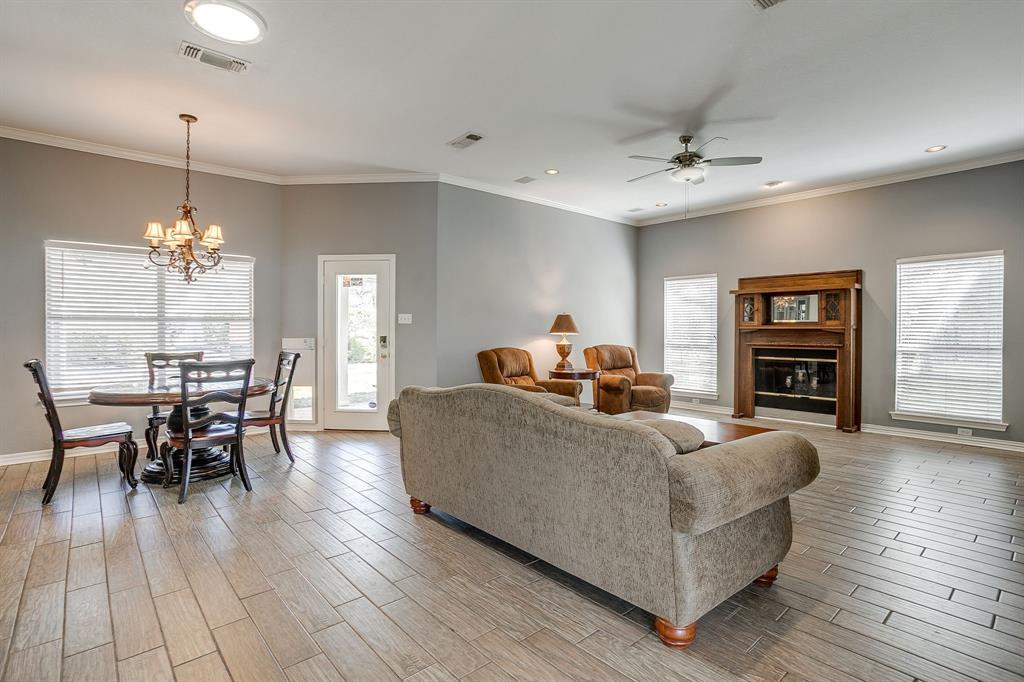 2300 Walter Smith Road Azle, TX 76020 - Photo 8 of 40 a living room with furniture and a wooden floor