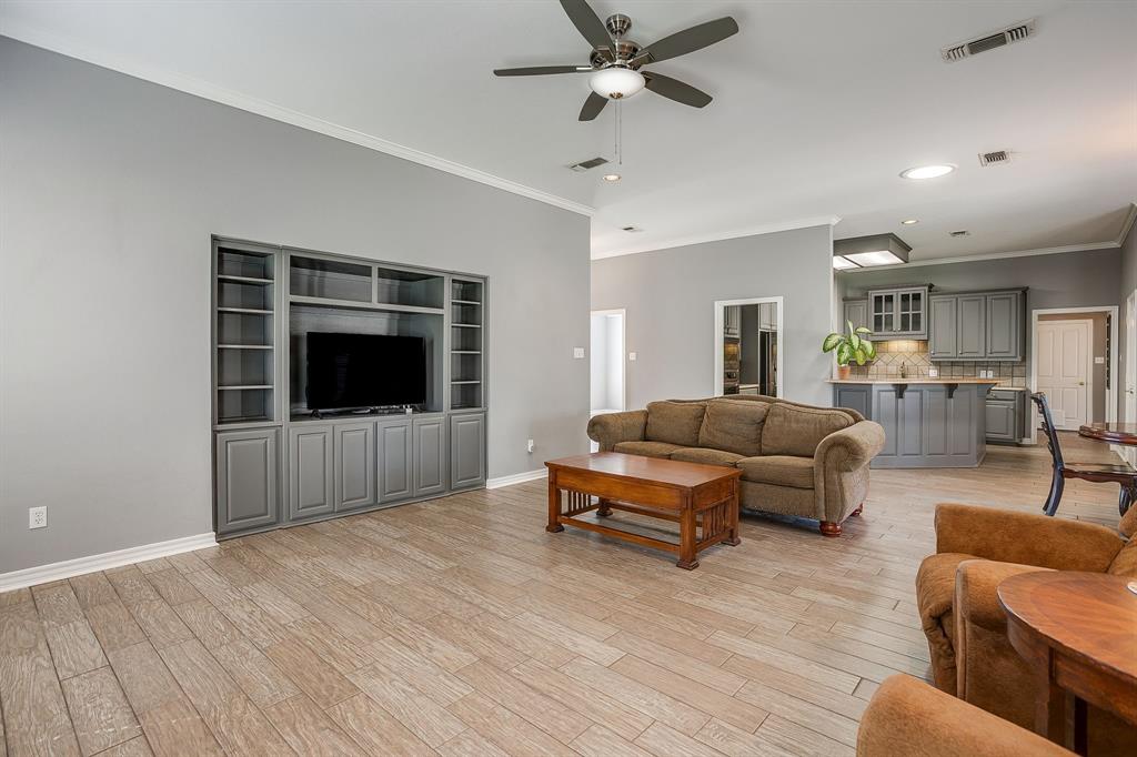 2300 Walter Smith Road Azle, TX 76020 - Photo 9 of 40 a living room with furniture and a flat screen tv