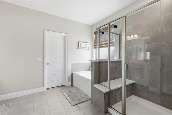 a bathroom with a shower and a sink