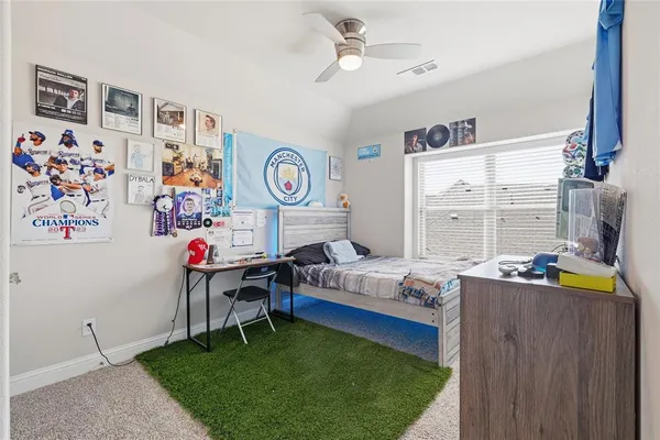 a living room with furniture and a clock