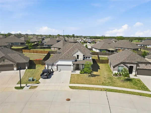 an aerial view of a yard with seating space