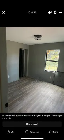 a view of room with a wooden floor