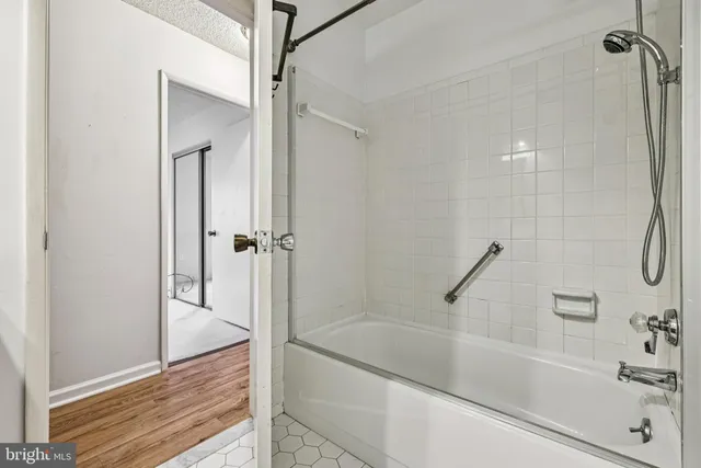 a bathroom with a bathtub and a shower