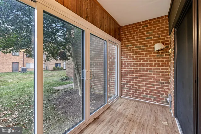 a view of wooden floor with a room