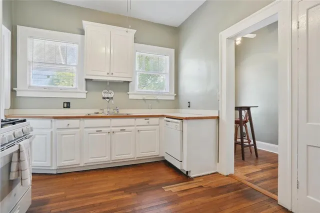 a kitchen with a sink stove and refrigerator