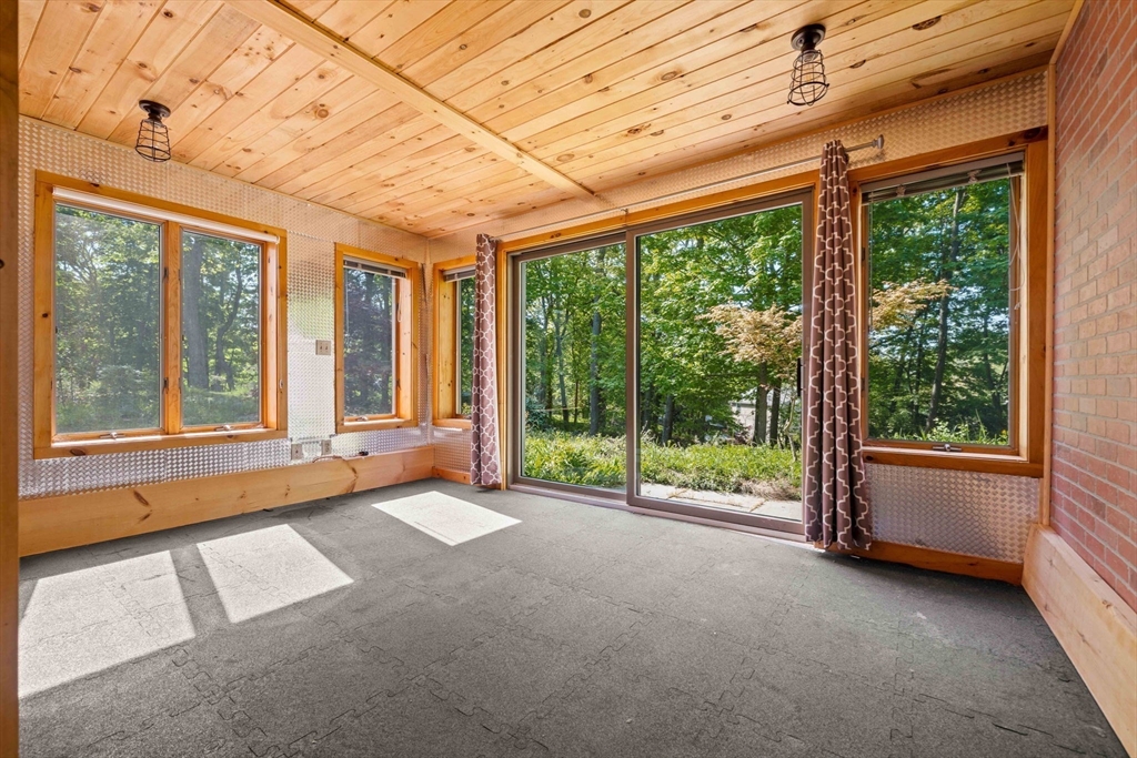 3 Whitman Place Beverly, MA 01915 - Photo 25 of 34 a view of a room with large windows and wooden walls