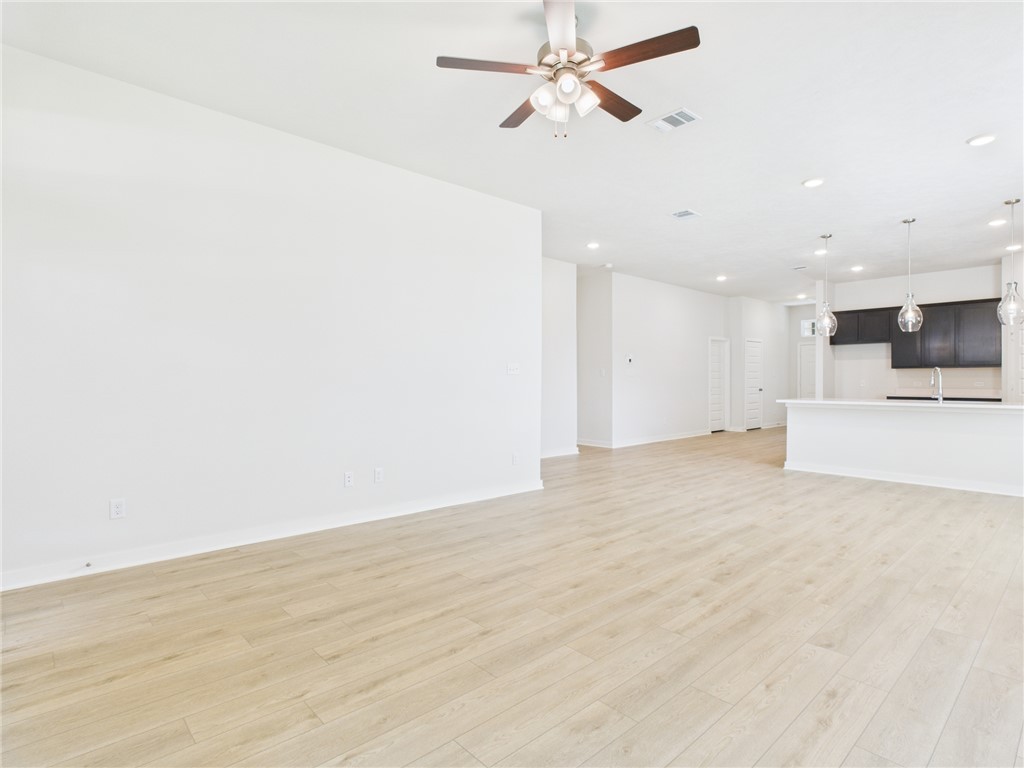 1932 Viva Road Bryan, TX 77807 - Photo 11 of 20 a view of a kitchen with a sink and a refrigerator