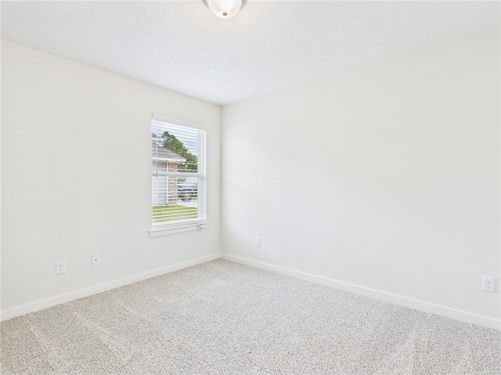 1932 Viva Road Bryan, TX 77807 - Photo 13 of 20 an empty room with a window