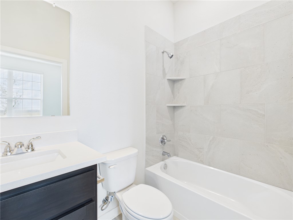 1932 Viva Road Bryan, TX 77807 - Photo 5 of 20 a bathroom with a sink toilet vanity and bathtub